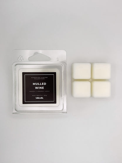 Mulled Wine 60g wax melt clamshell placed beside four wax cubes from the Hellomelts Winter Collection