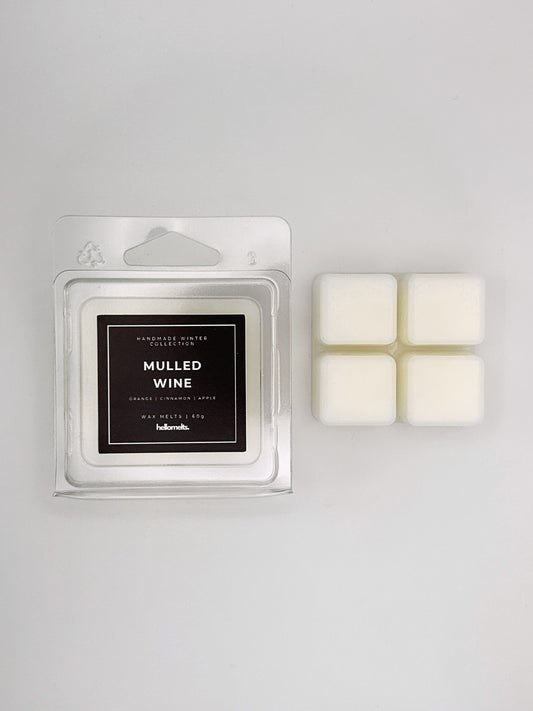 Mulled Wine 60g wax melt clamshell placed beside four wax cubes from the Hellomelts Winter Collection