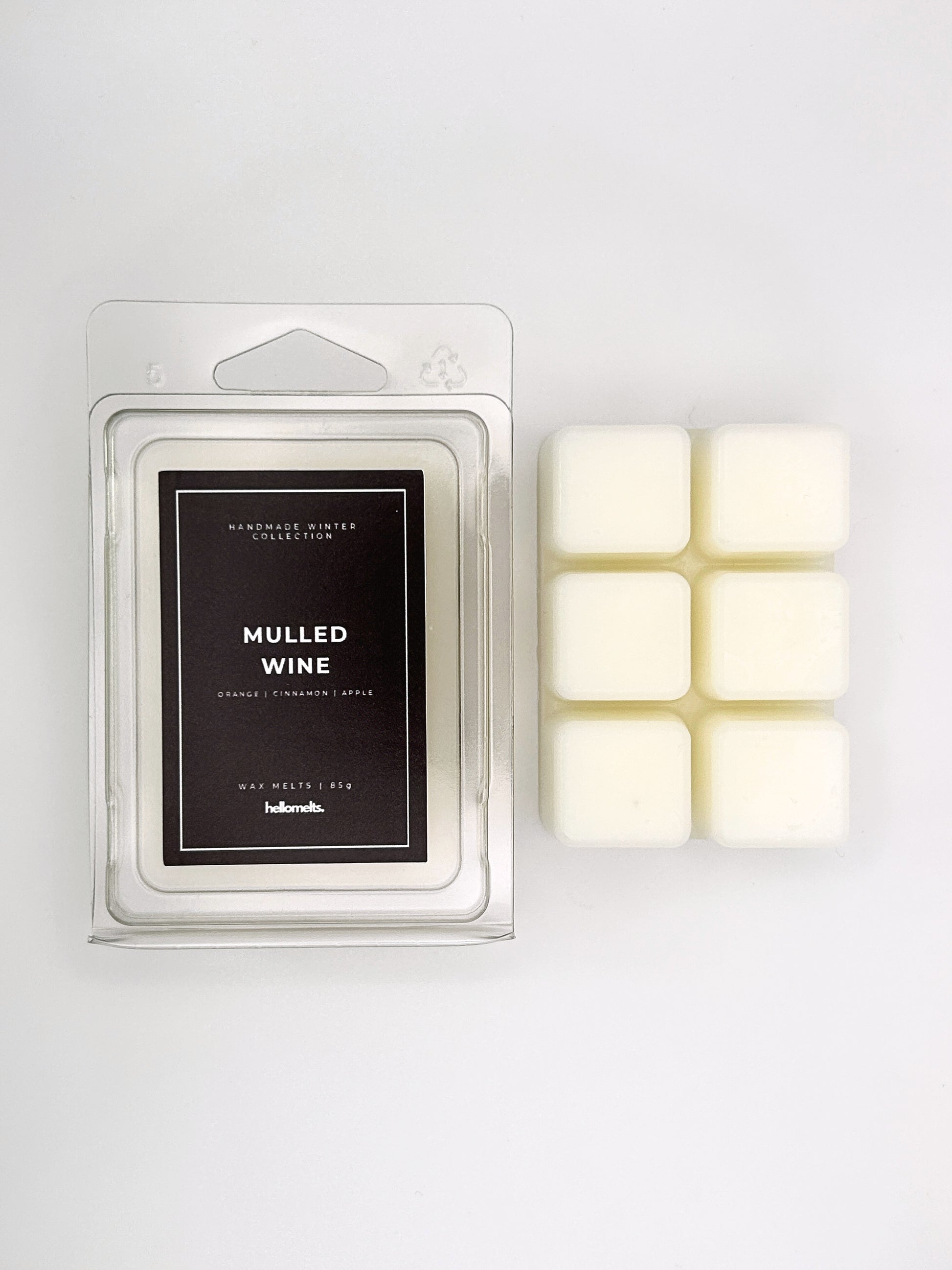 Mulled Wine 85g wax melt clamshell placed beside six wax cubes from the Hellomelts Winter Collection