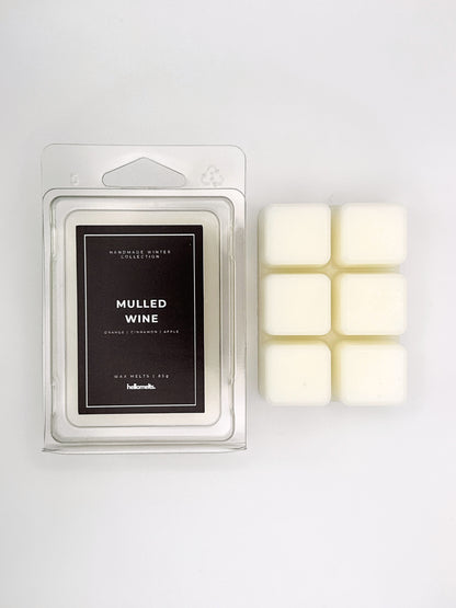 Mulled Wine 85g wax melt clamshell placed beside six wax cubes from the Hellomelts Winter Collection