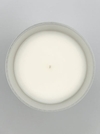 Nordic Cedar 220g candle close-up top-down image showing the wax surface and centred wick from the Hellomelts Winter Collection