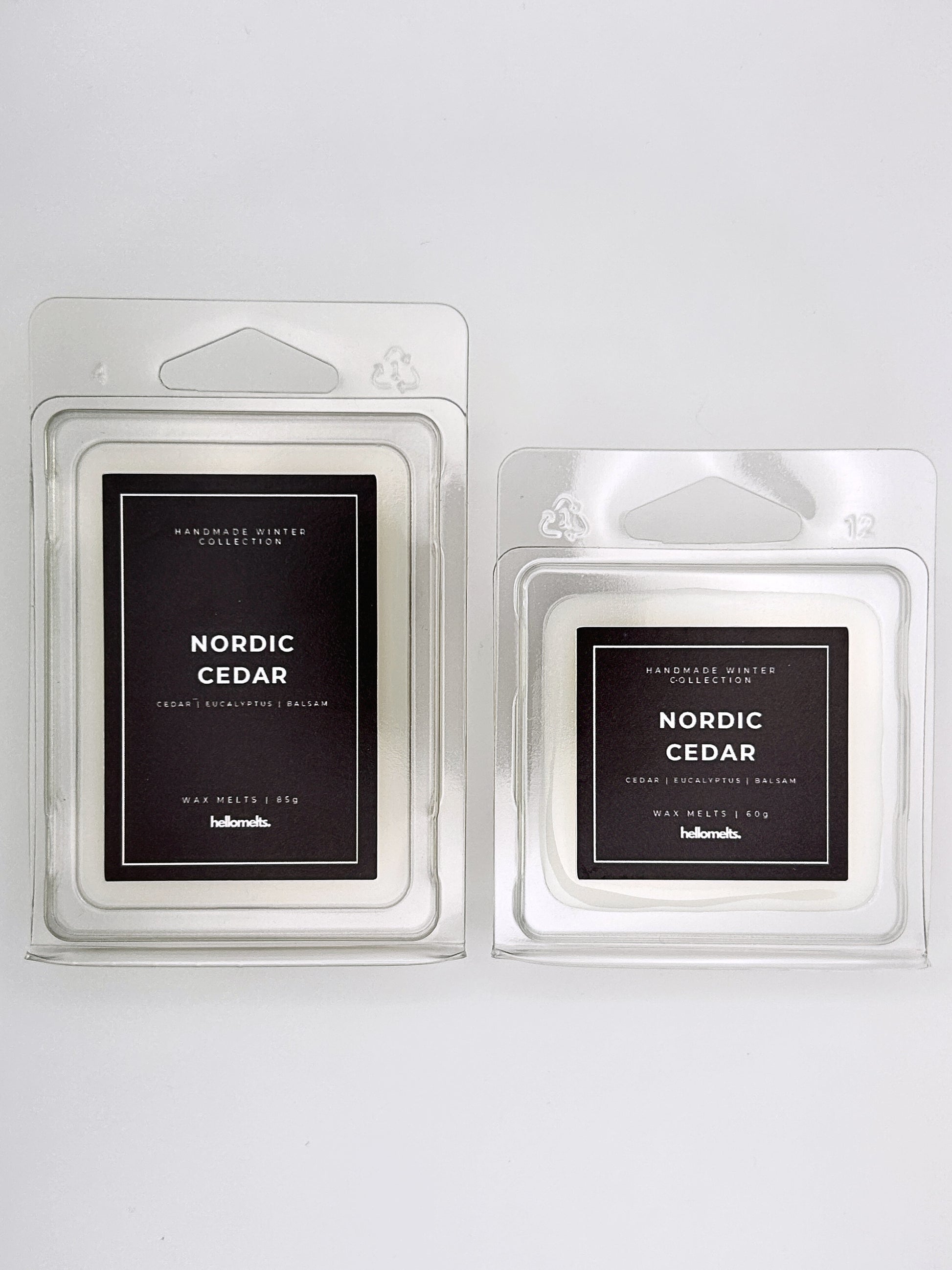 Nordic Cedar wax melts 85g and 60g shown together as a size comparison in clamshell packaging from the Hellomelts Winter Collection