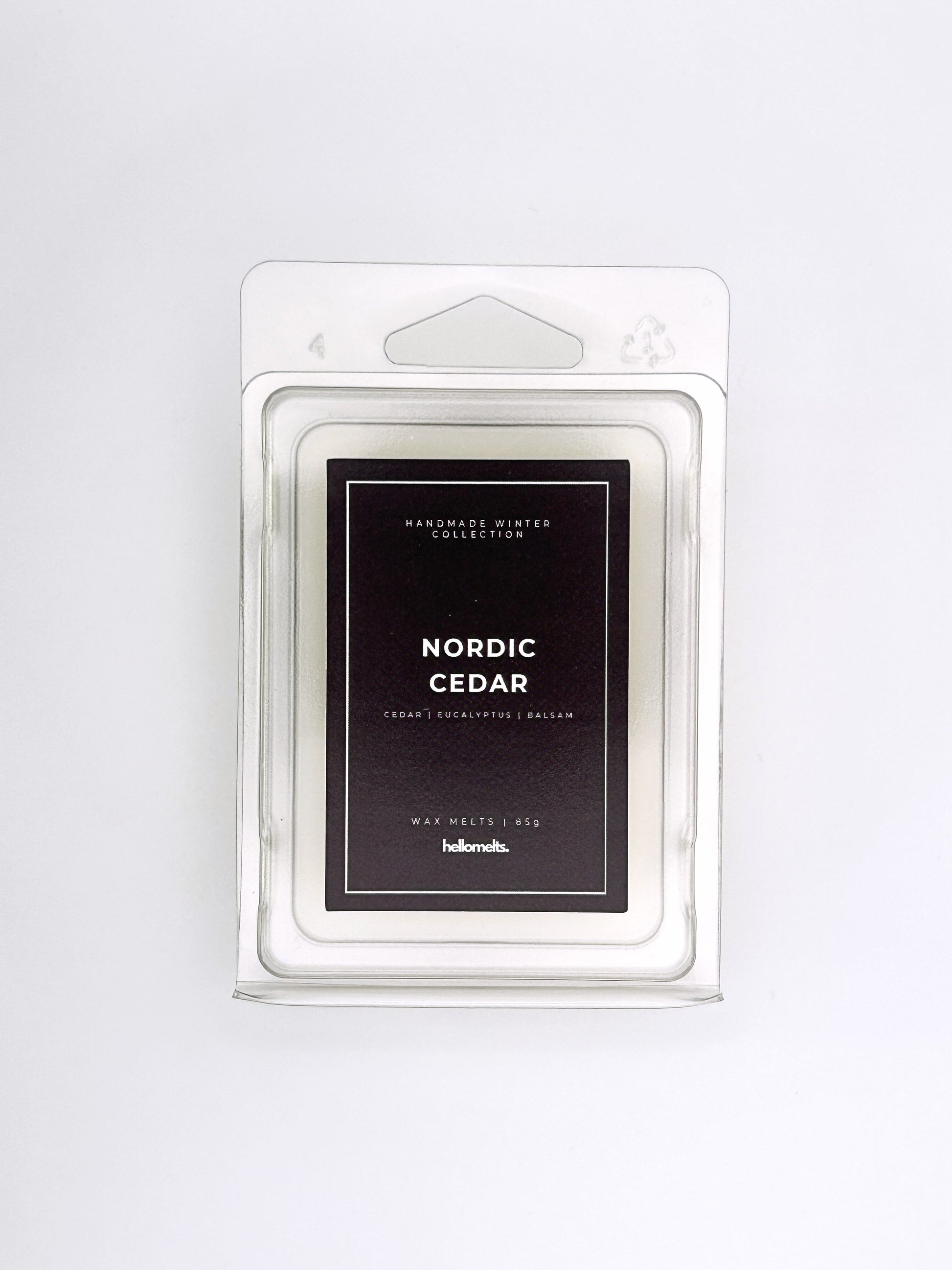 Nordic Cedar 85g wax melt front-facing studio shot showing the clamshell packaging from the Hellomelts Winter Collection