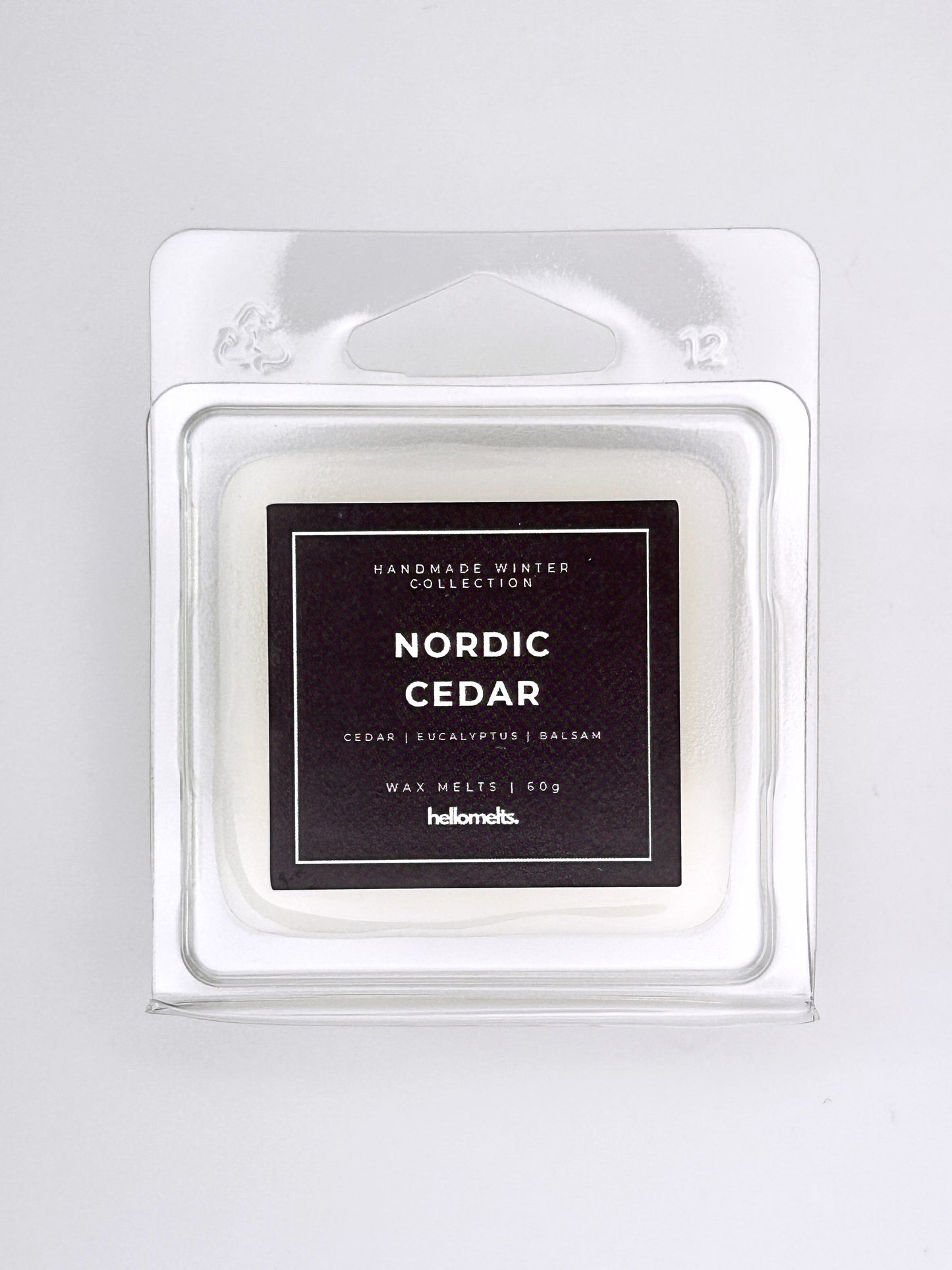 Nordic Cedar 60g wax melt label close-up on the clamshell packaging from the Hellomelts Winter Collection