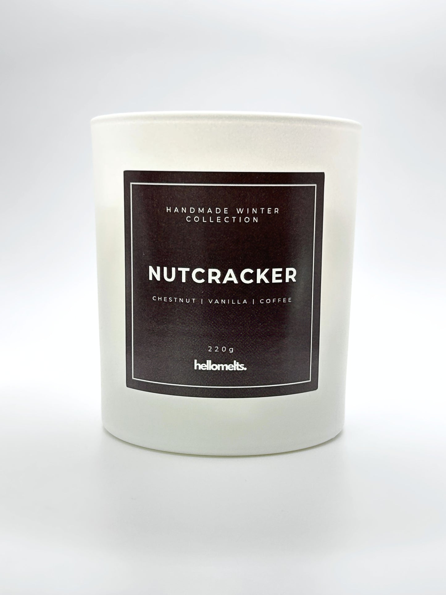 Nutcracker 220g candle front-facing studio shot without the lid, showing the clean white jar and label from the Hellomelts Winter Collection