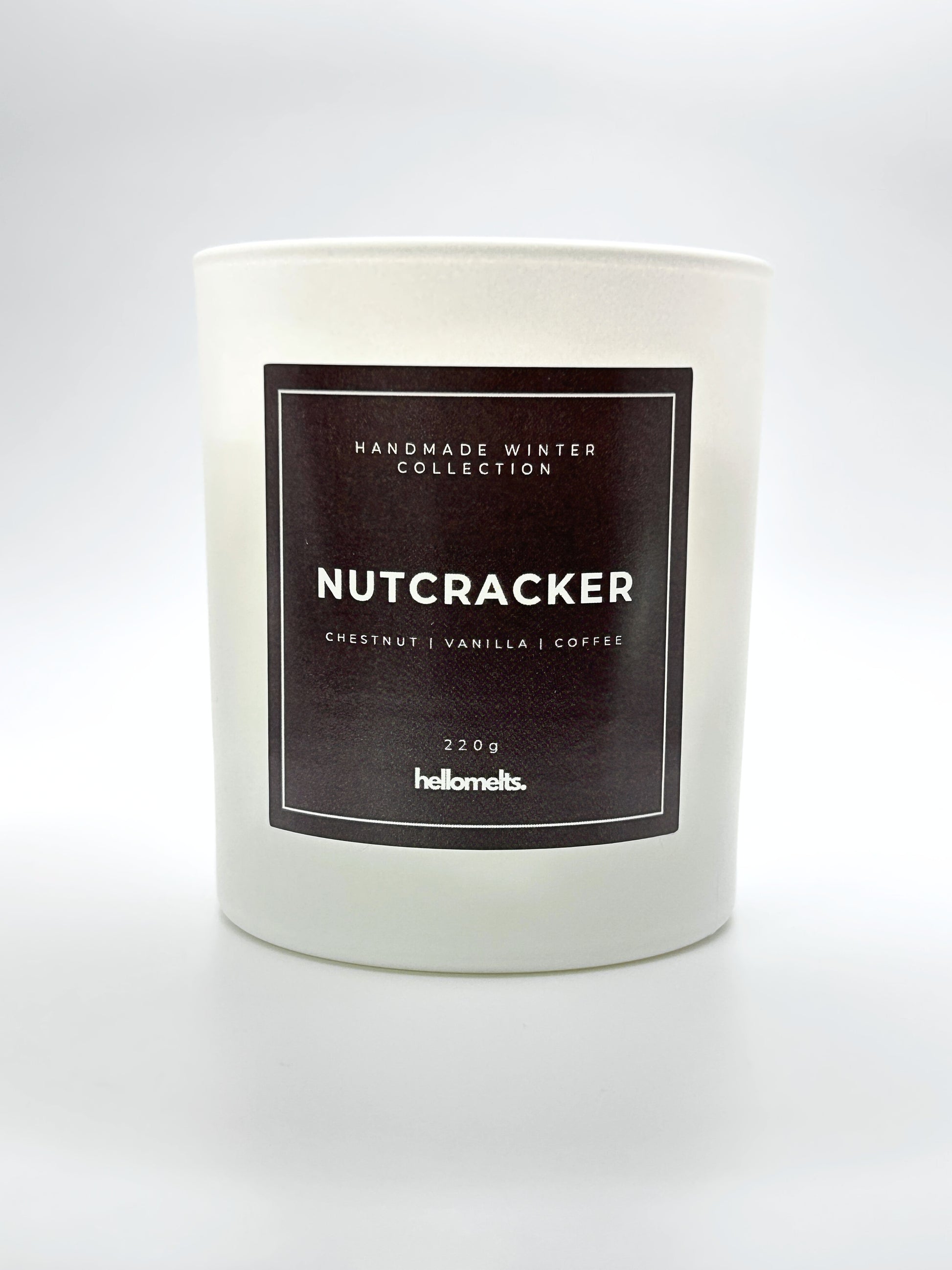 Nutcracker 220g candle front-facing studio shot without the lid, showing the clean white jar and label from the Hellomelts Winter Collection