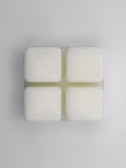 Flatlay of Passionfruit & Mango wax melt bar in 60g size, removed from packaging to show 4 cubed wax melt bar