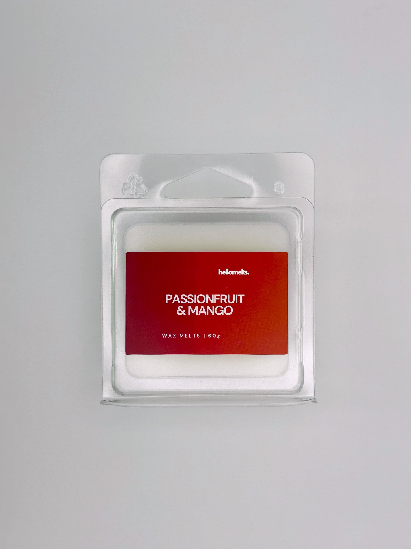 Flatlay of Passionfruit & Mango 60g wax melt bar by Hellomelts, part of the Summer Collection with tropical colours and bold design