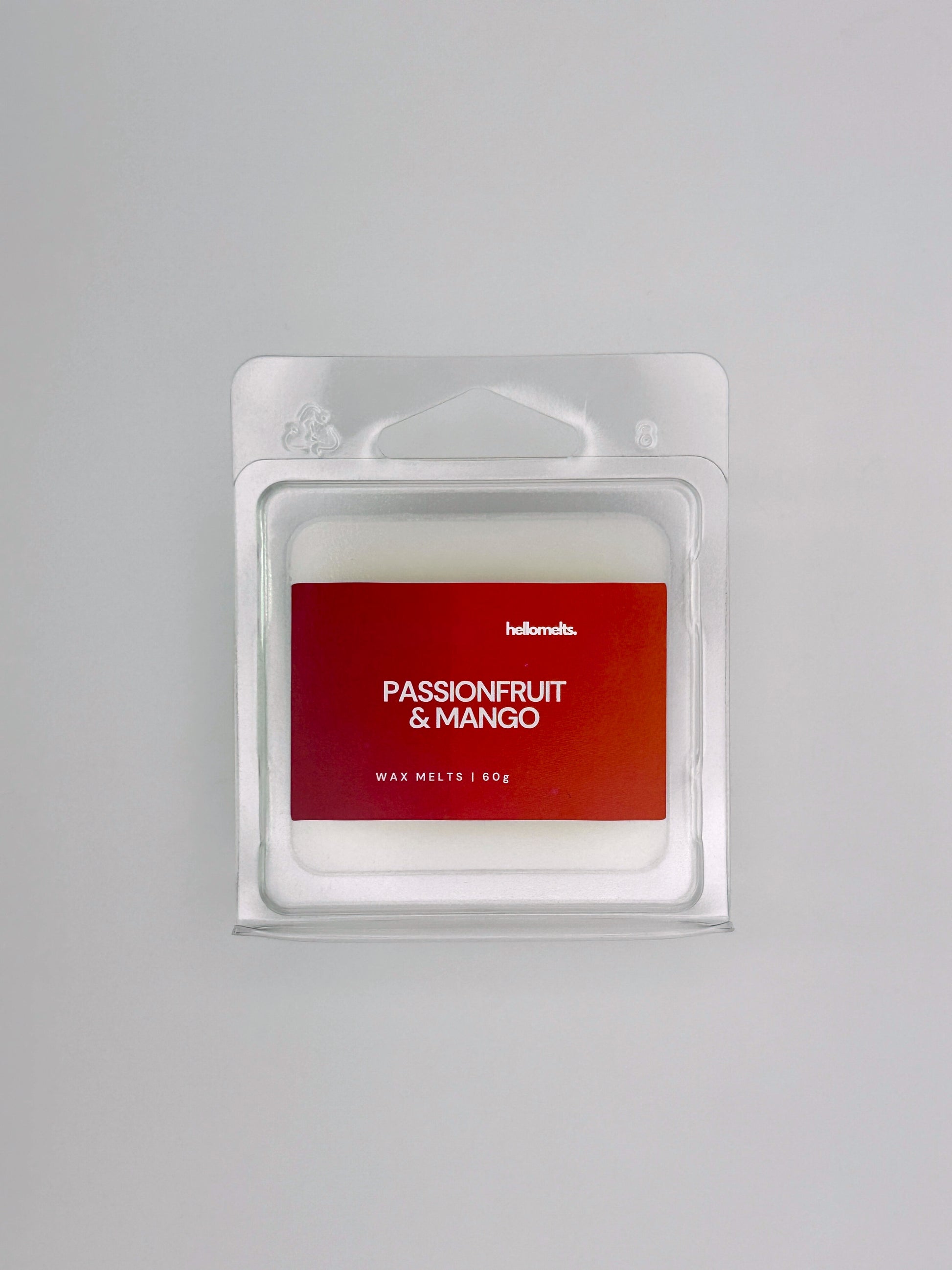 Flatlay of Passionfruit & Mango 60g wax melt bar by Hellomelts, part of the Summer Collection with tropical colours and bold design