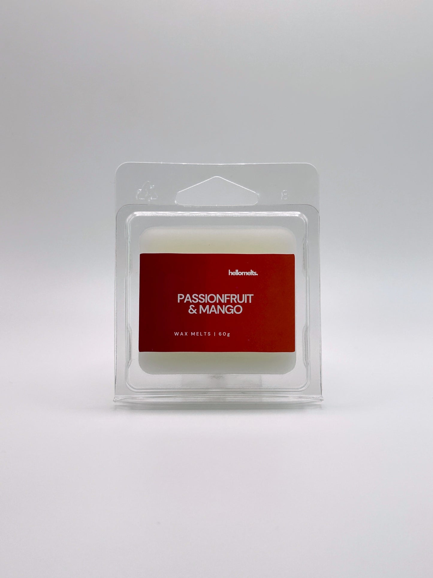 Front-facing view of Hellomelts Passionfruit & Mango 60g wax melt bar from the Summer Collection, featuring bright tropical packaging