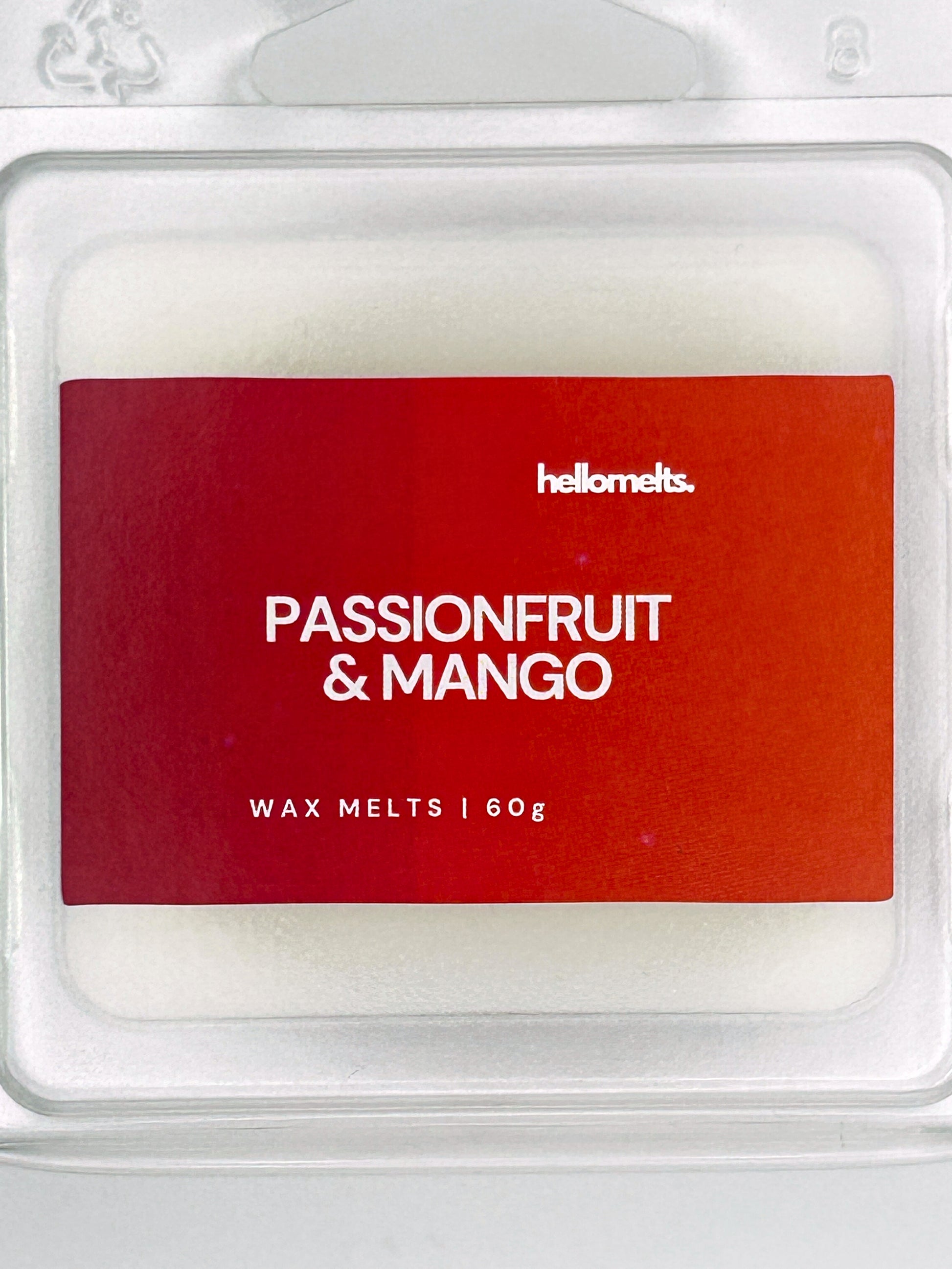 Close-up of the Passionfruit & Mango 60g wax melt label, showing detailed branding and tropical fruit scent design from Hellomelts