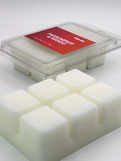 Angled shot of Passionfruit & Mango 85g wax melt bar in front of its packaging, part of the Summer Collection by Hellomelts