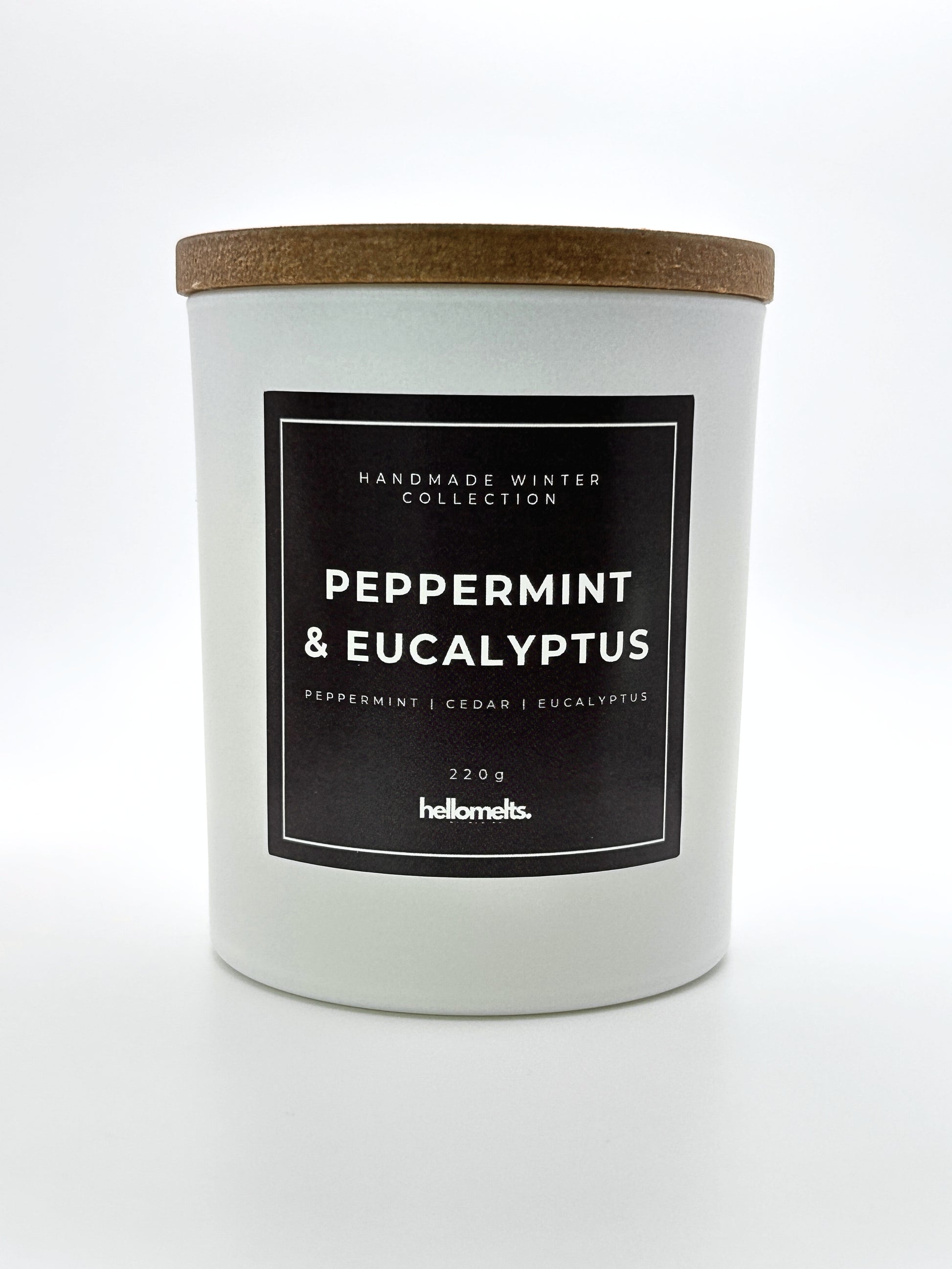 Peppermint & Eucalyptus 220g candle front-facing studio shot with wooden lid on, part of the Hellomelts Winter Collection