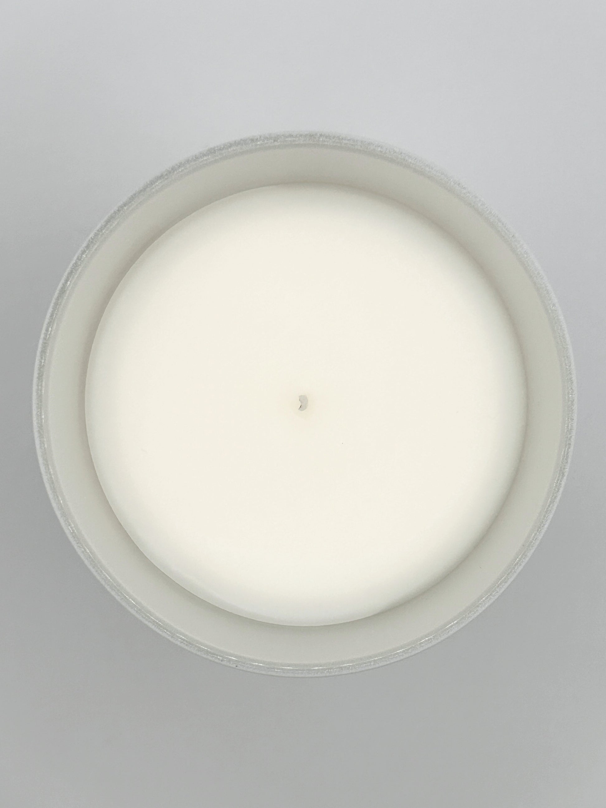 Peppermint & Eucalyptus 220g candle close-up top-down image showing the wax surface and centred wick from the Hellomelts Winter Collection