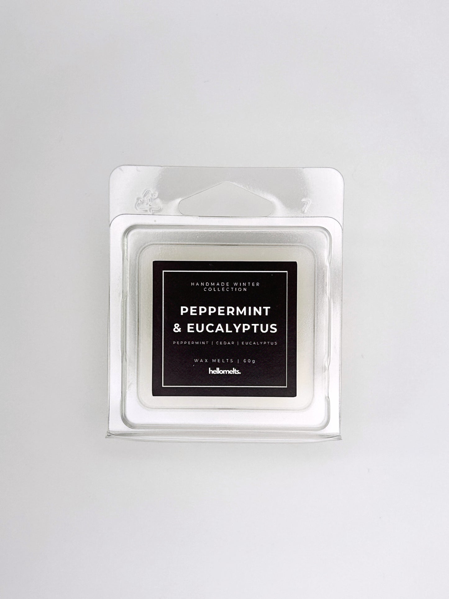 Peppermint & Eucalyptus 60g wax melt front-facing studio shot showing the clamshell packaging from the Hellomelts Winter Collection