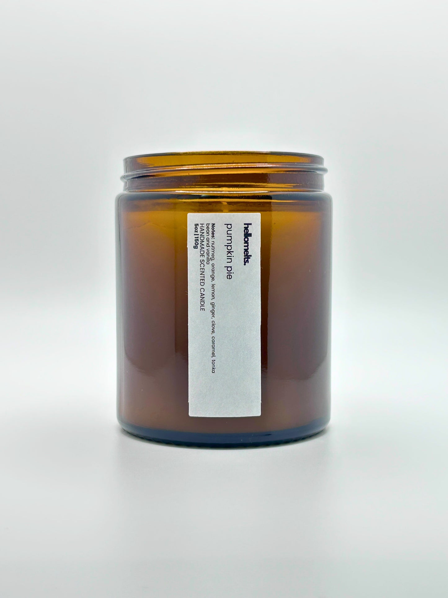 Front view of Pumpkin Pie autumn scented candle by Hellomelts with the lid off, part of the Autumn Collection
