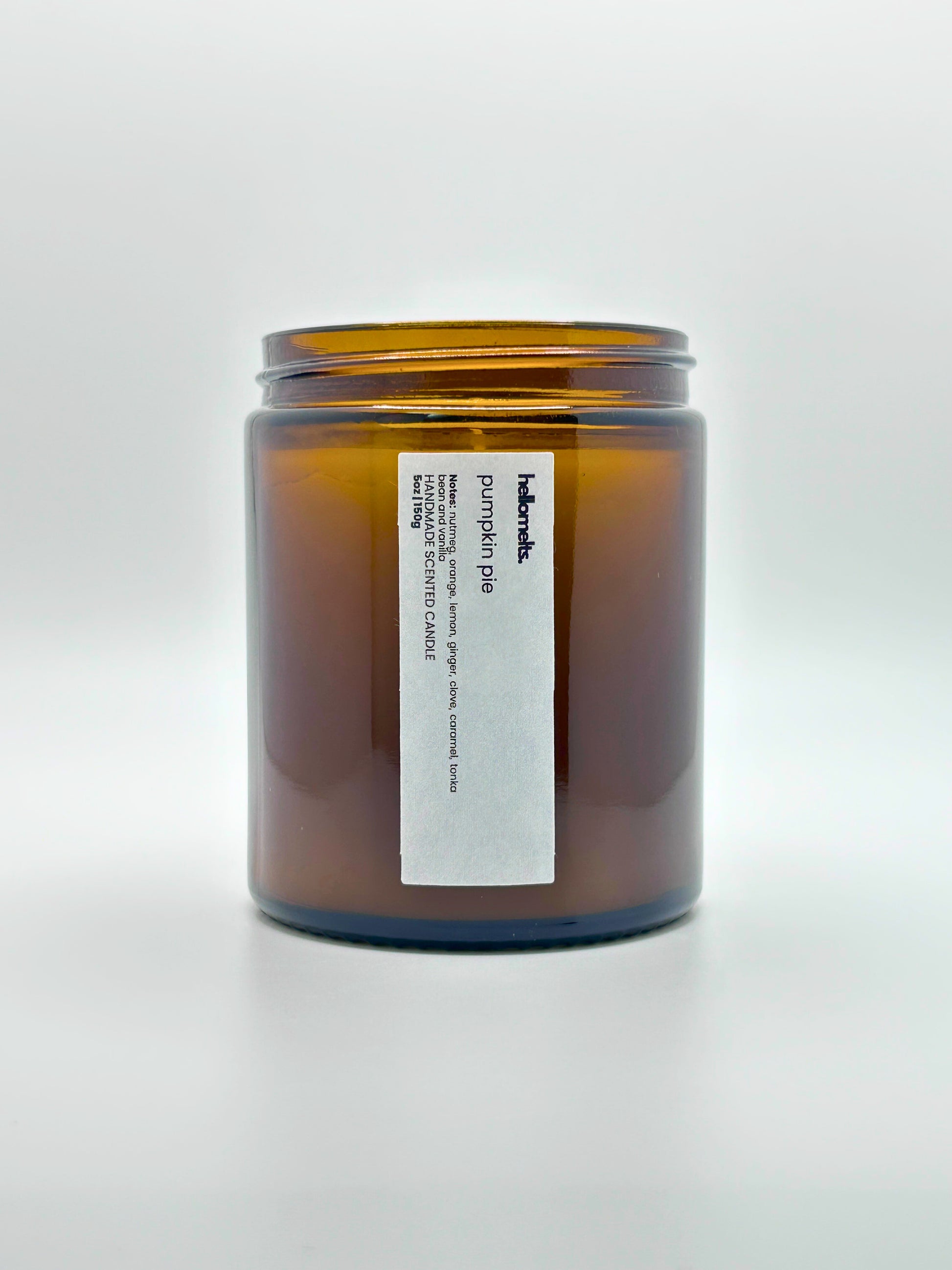 Front view of Pumpkin Pie autumn scented candle by Hellomelts with the lid off, part of the Autumn Collection
