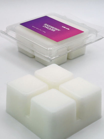 Angled shot of Raspberry Daiquiri 60g wax melt bar in front of its packaging, part of the Summer Collection by Hellomelts