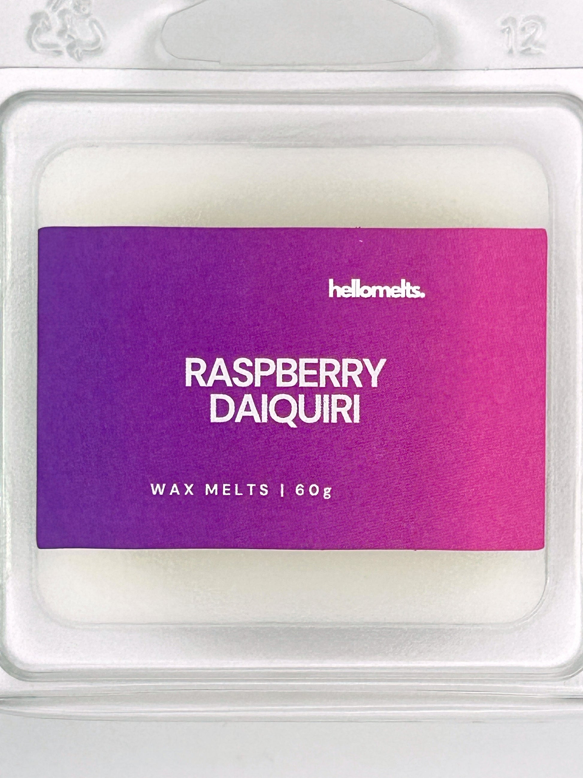 Close-up of the Raspberry Daiquiri 60g wax melt label, showing detailed branding and cocktail-inspired scent design from Hellomelts