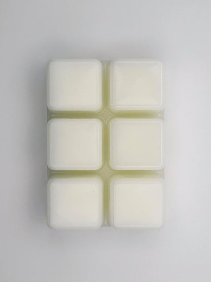 Flatlay of Raspberry Daiquiri wax melt bar in 85g size, removed from packaging to show 6 cubed wax melt bar