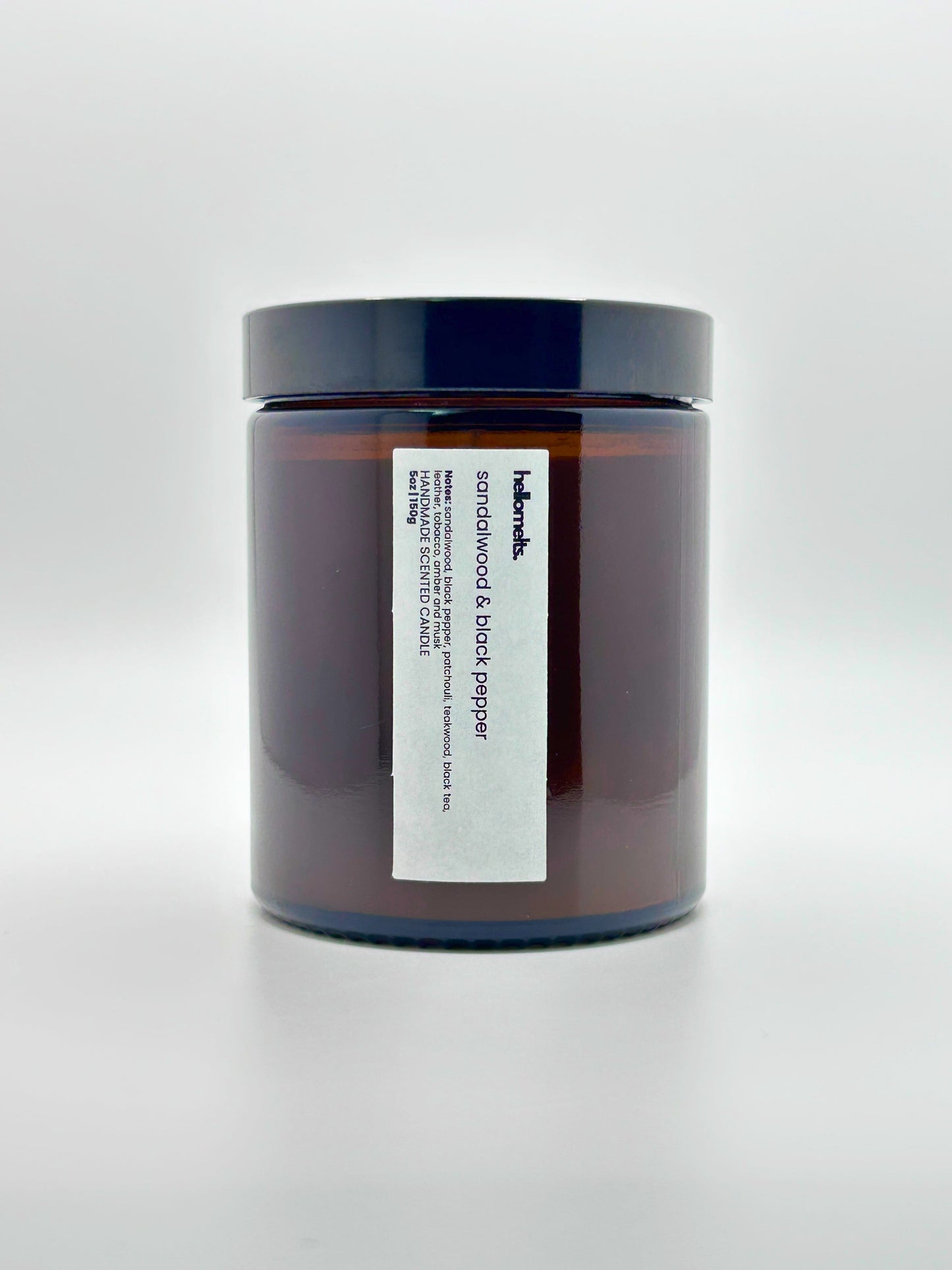 Front view of Sandalwood & Black Pepper autumn candle by Hellomelts with the lid on, part of the Autumn Collection