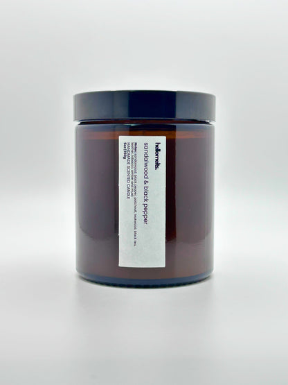 Front view of Sandalwood & Black Pepper autumn candle by Hellomelts with the lid on, part of the Autumn Collection