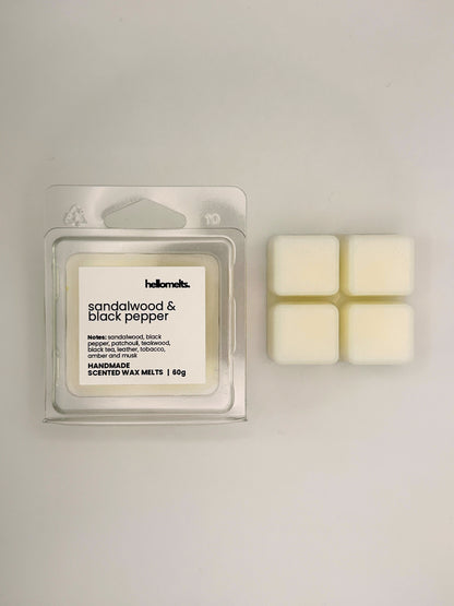 Sandalwood & Black Pepper 60g wax melt bar displayed beside its clear clamshell packaging from the Hellomelts Autumn Collection