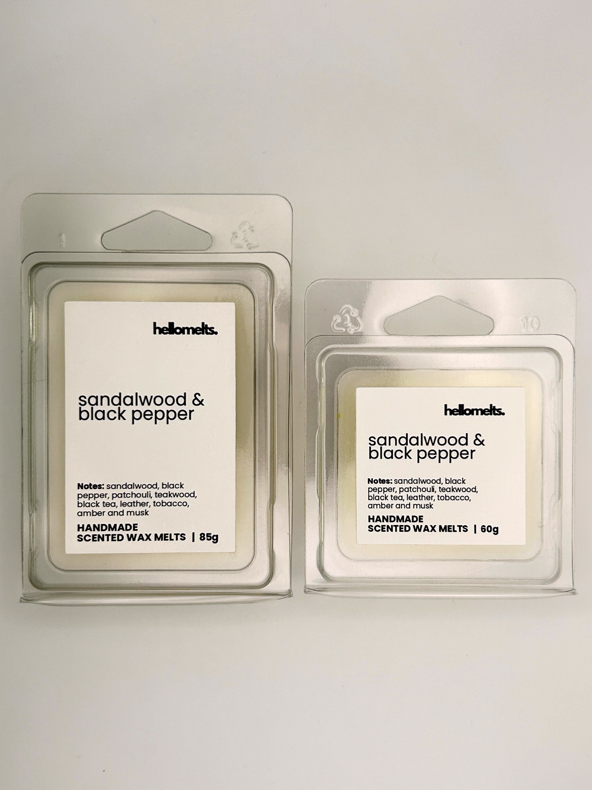 Sandalwood & Black Pepper wax melts in 60g and 85g clamshells shown side by side from the Hellomelts Autumn Collection