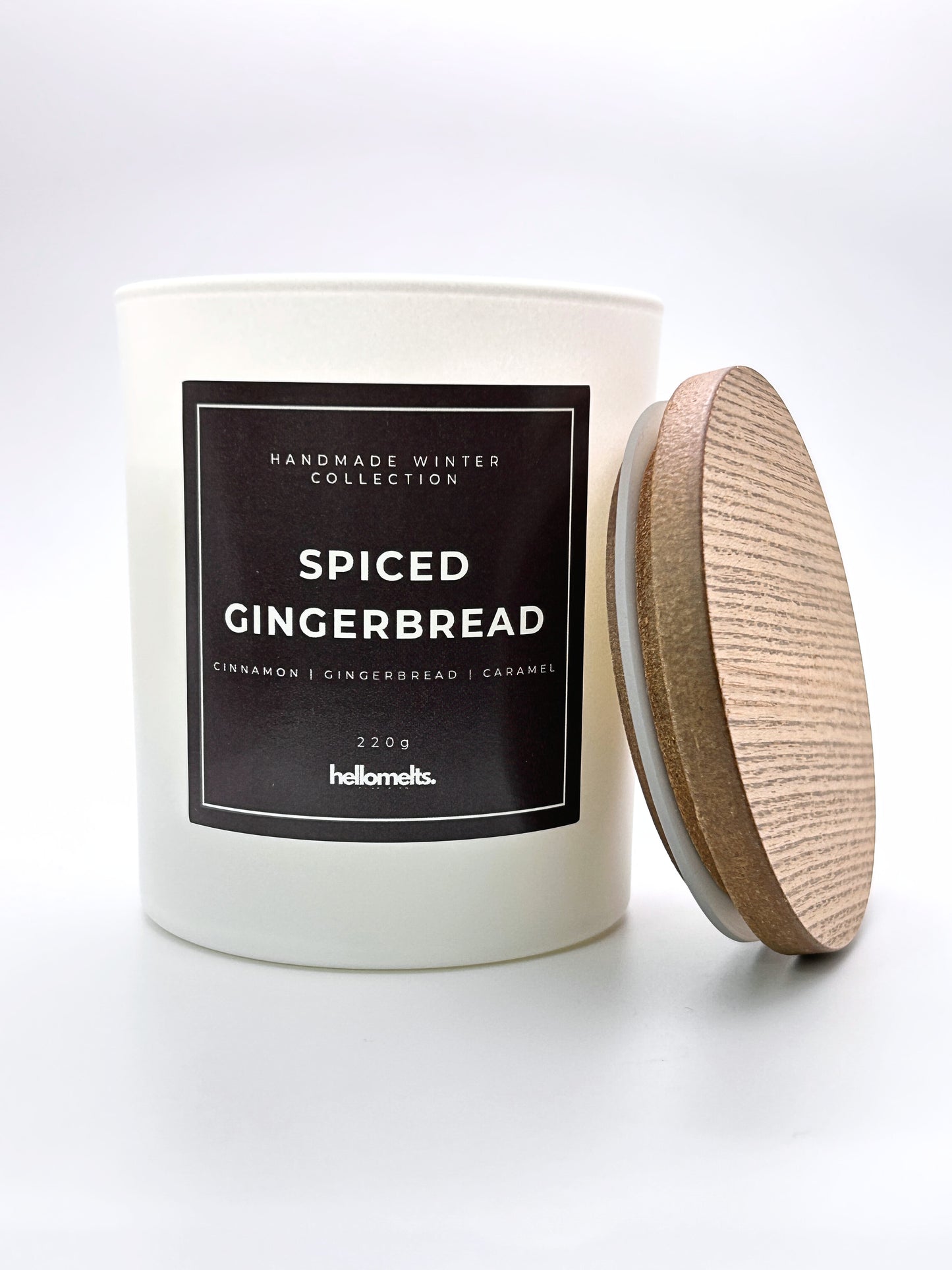 Spiced Gingerbread 220g candle front-facing studio shot with the wooden lid positioned at the side, part of the Hellomelts Winter Collection