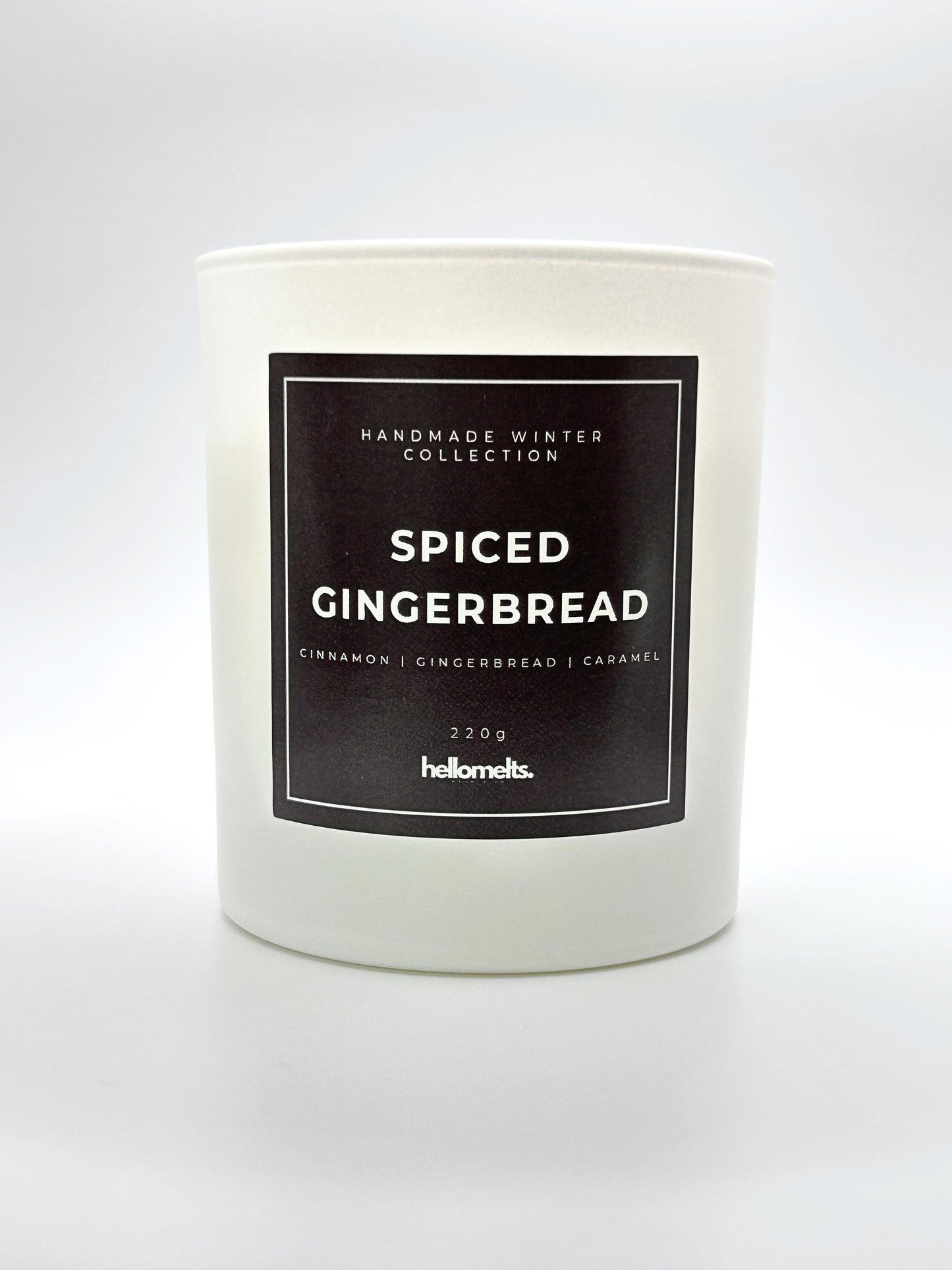 Spiced Gingerbread 220g candle front-facing studio shot without the lid, showing the clean white jar and label from the Hellomelts Winter Collection