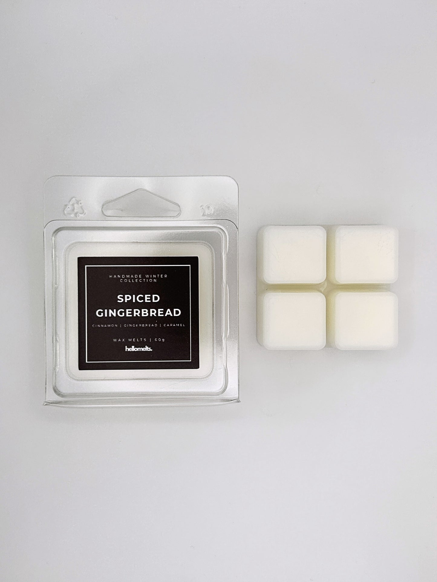 Spiced Gingerbread 60g wax melt clamshell placed beside four wax cubes from the Hellomelts Winter Collection