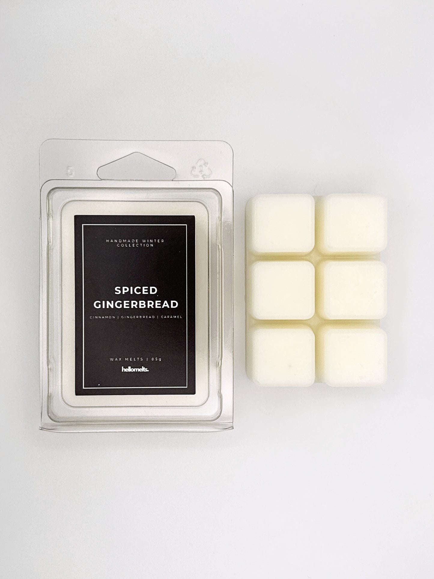 Spiced Gingerbread 85g wax melt clamshell placed beside six wax cubes from the Hellomelts Winter Collection