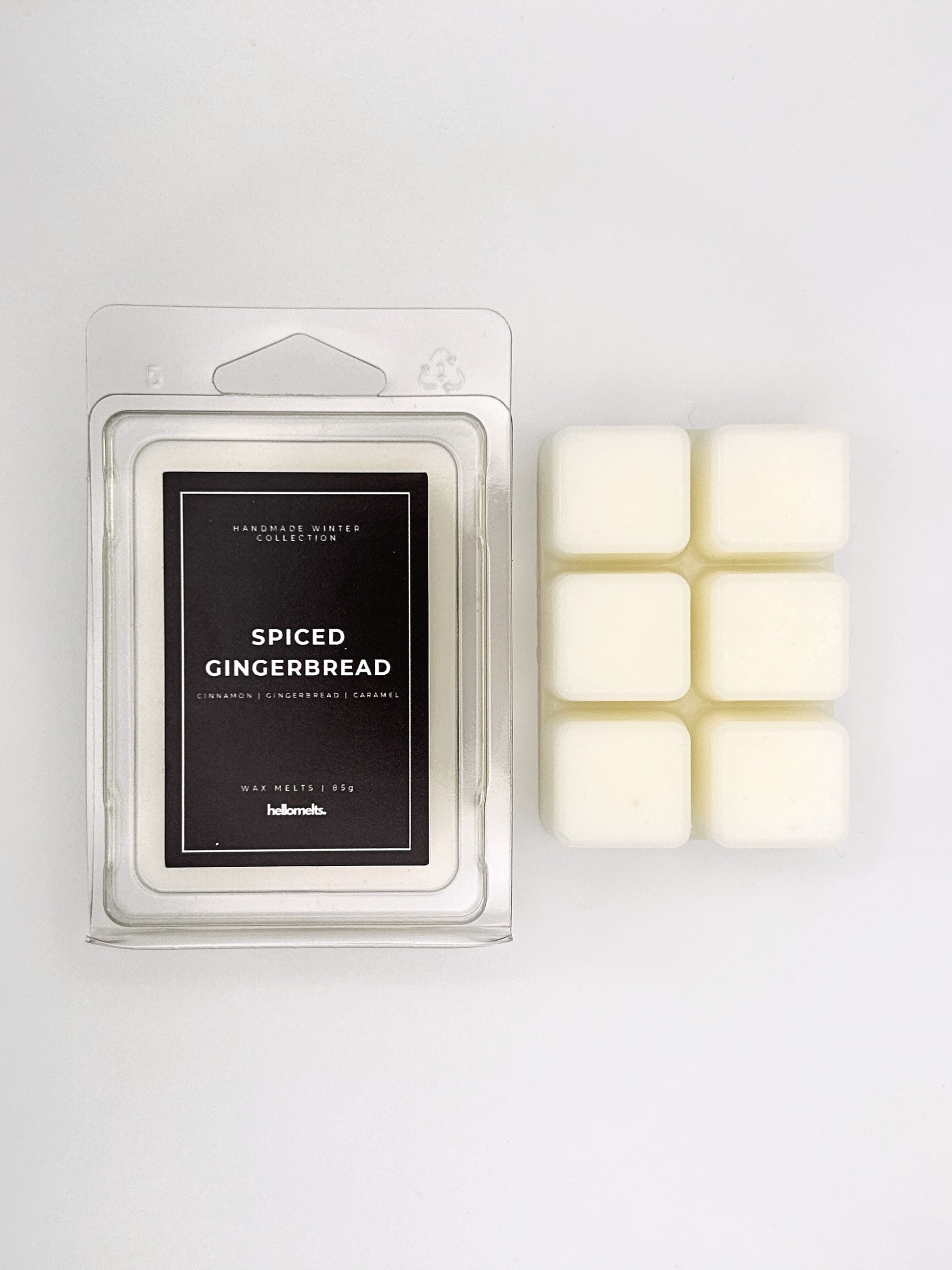 Spiced Gingerbread 85g wax melt clamshell placed beside six wax cubes from the Hellomelts Winter Collection