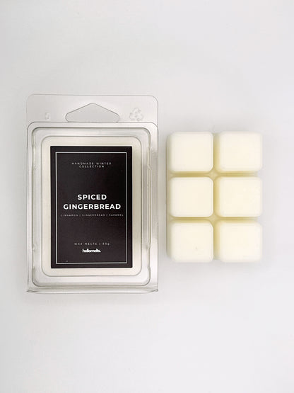 Spiced Gingerbread 85g wax melt clamshell placed beside six wax cubes from the Hellomelts Winter Collection
