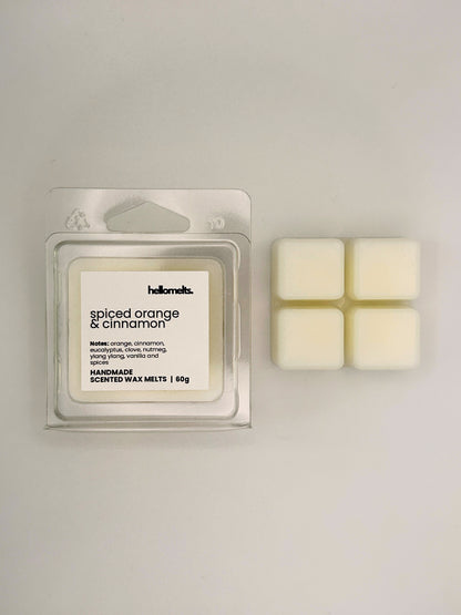 Spiced Orange & Cinnamon 60g wax melt bar displayed beside its clear clamshell packaging from the Hellomelts Autumn Collection