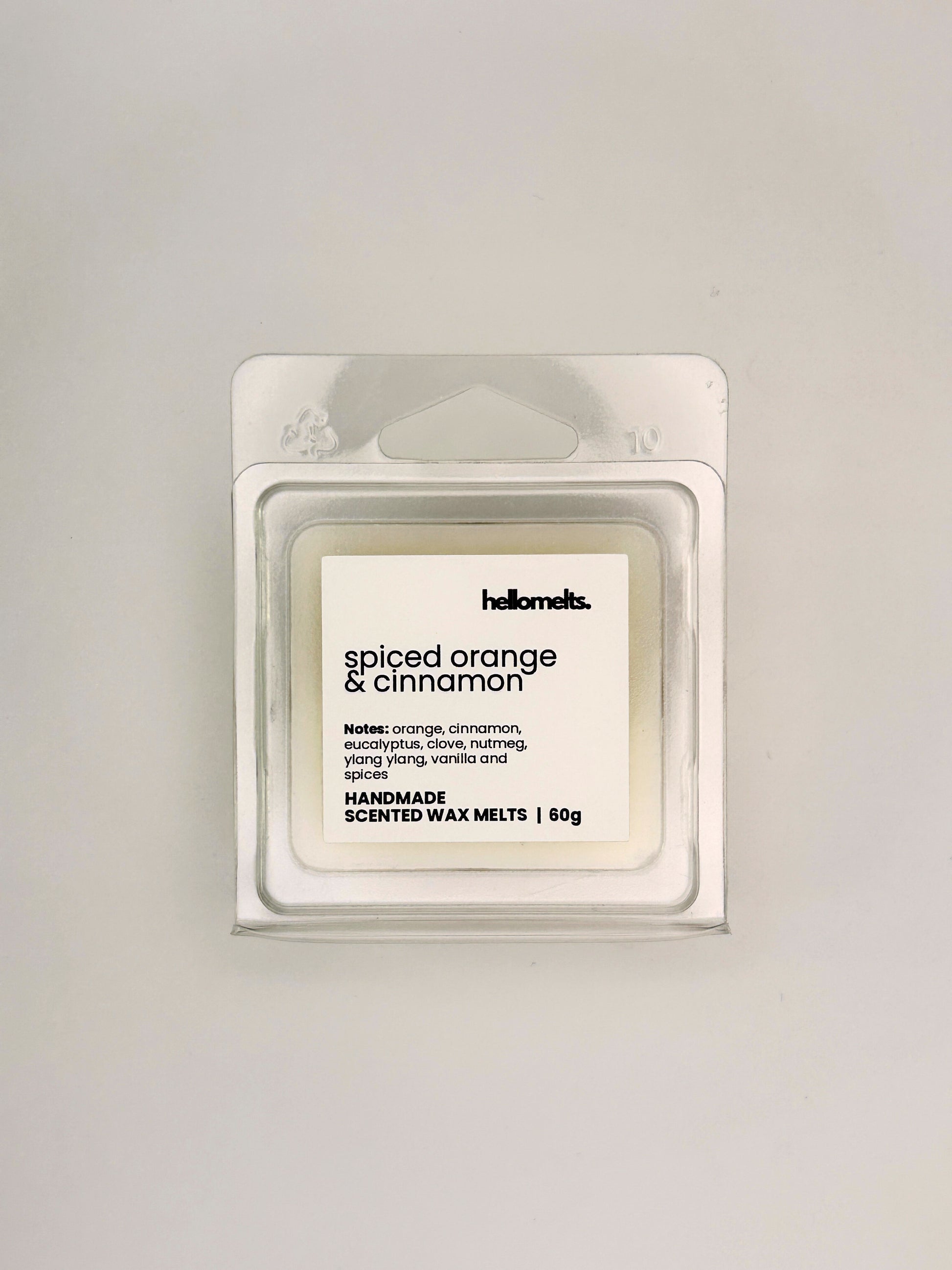 Front view of Spiced Orange & Cinnamon 60g wax melt in clear clamshell packaging from the Hellomelts Autumn Collection