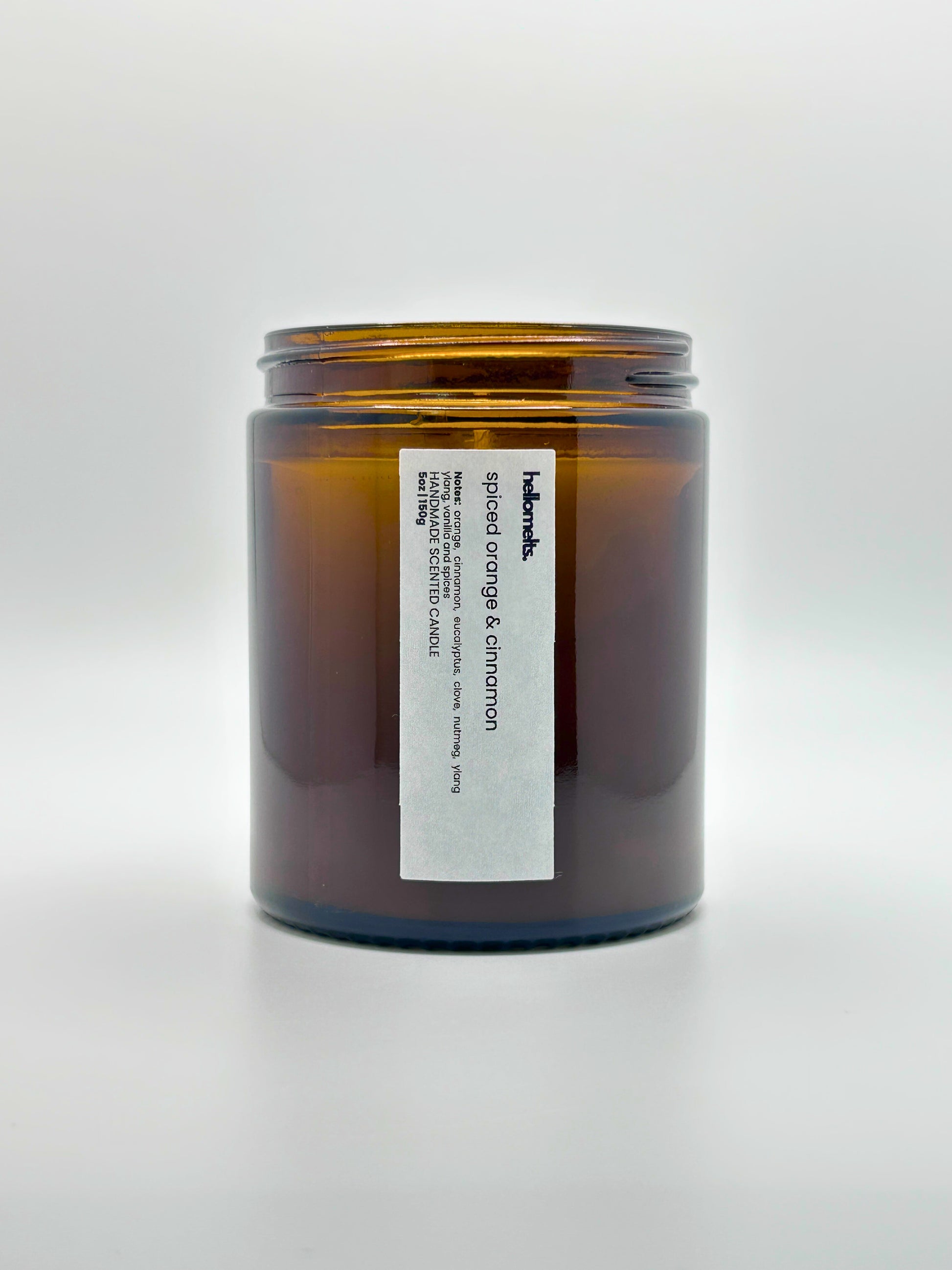 Front view of Spiced Orange & Cinnamon autumn scented candle by Hellomelts with the lid off, part of the Autumn Collection