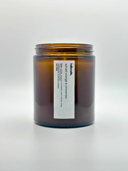 Front view of Spiced Orange & Cinnamon autumn scented candle by Hellomelts with the lid off, part of the Autumn Collection