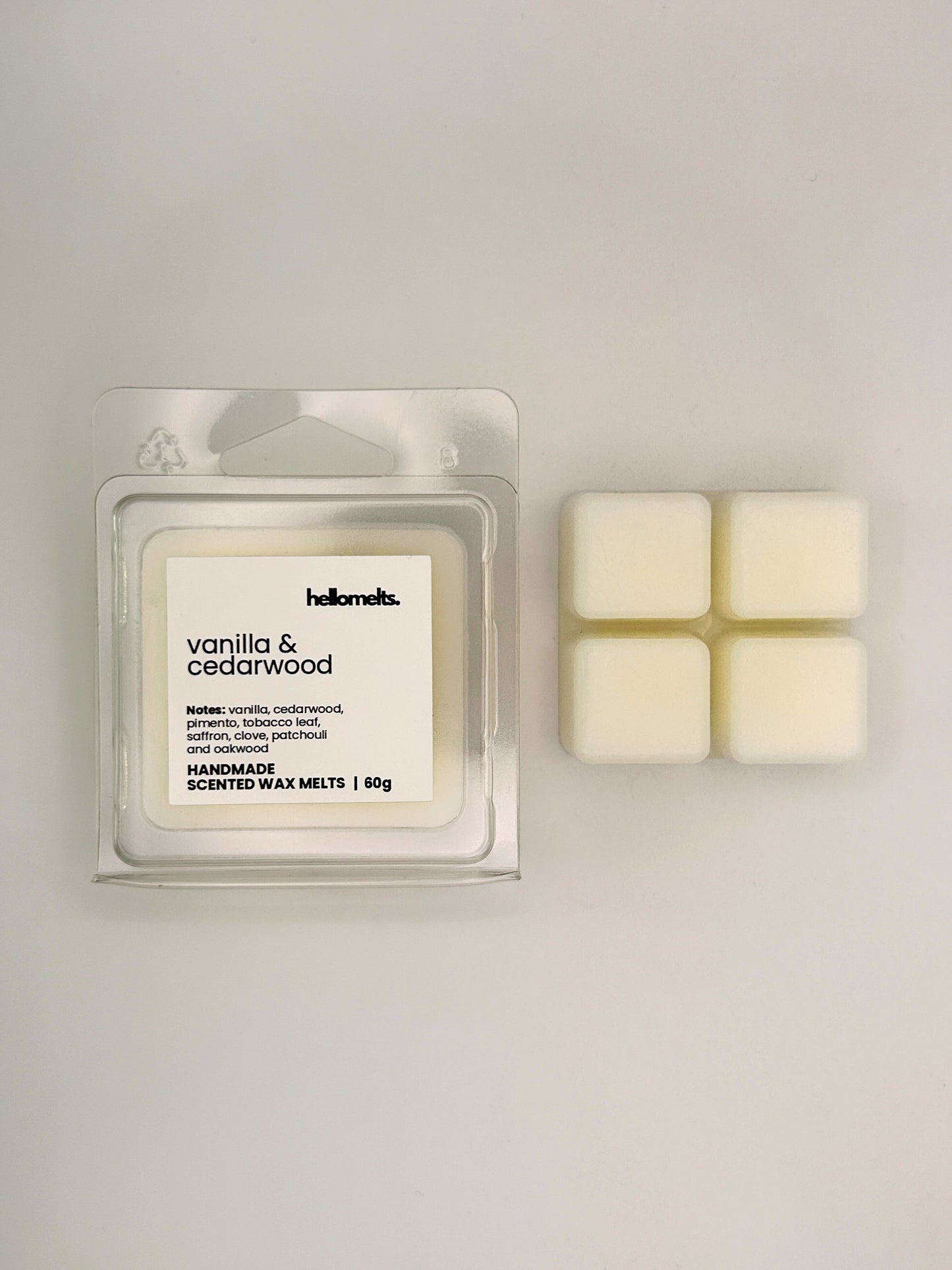 Vanilla & Cedarwood 60g wax melt bar displayed beside its clear clamshell packaging from the Hellomelts Autumn Collection