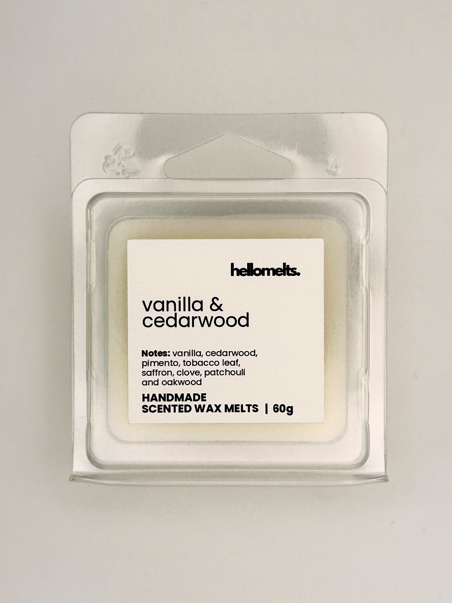 Close up of Vanilla & Cedarwood 60g wax melt label on clear clamshell packaging from the Hellomelts Autumn Collection