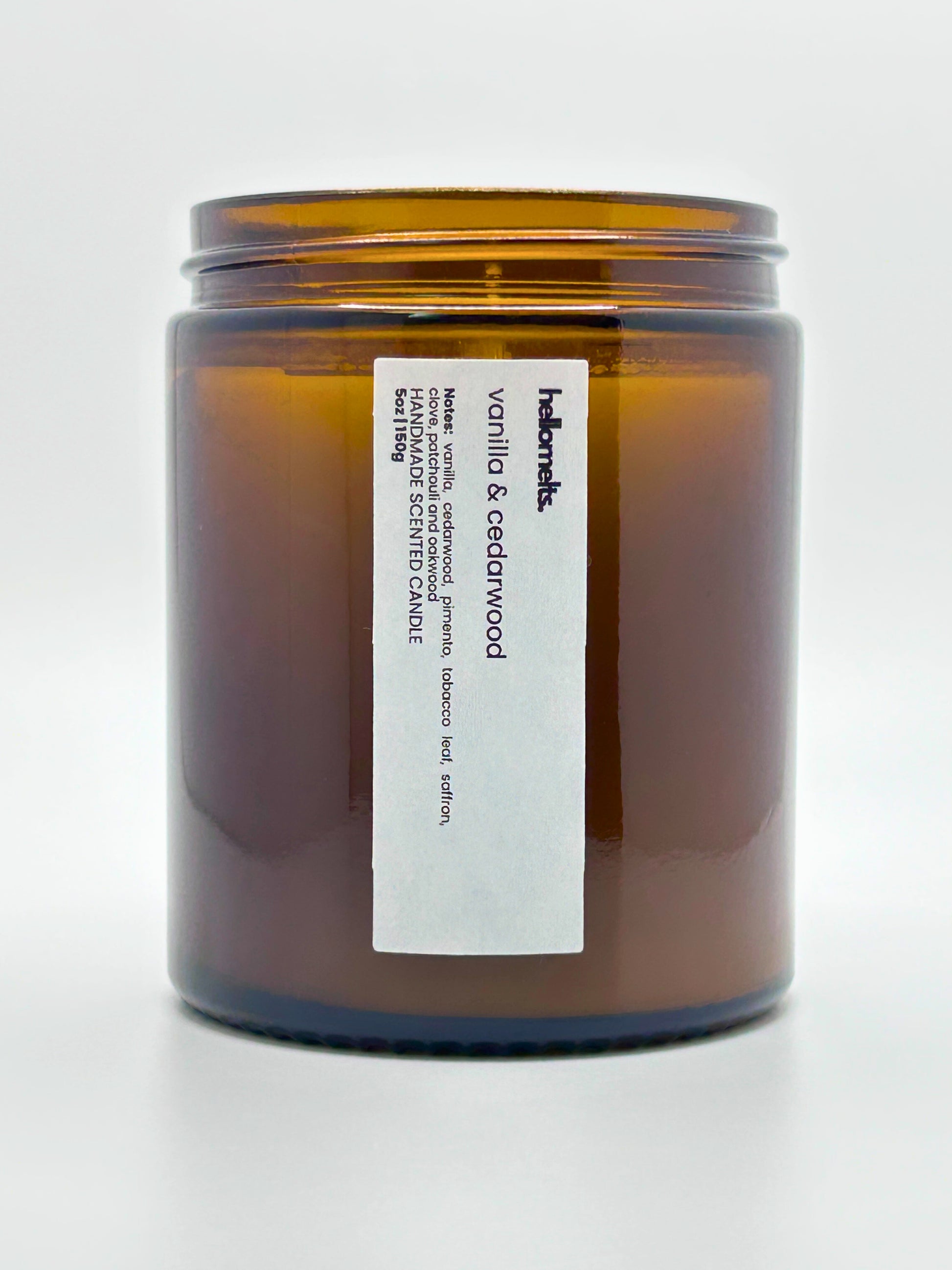 Close-up front view of Vanilla & Cedarwood autumn scented candle by Hellomelts with the lid off, part of the Autumn Collection