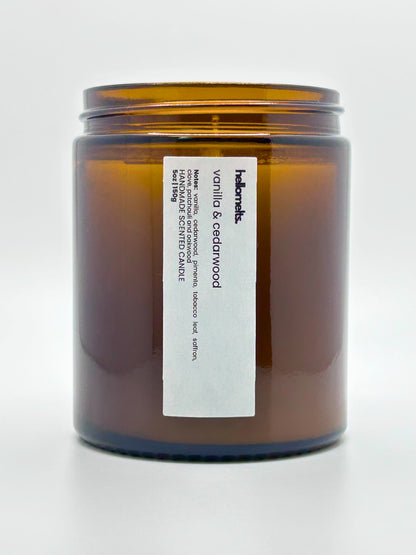 Close-up front view of Vanilla & Cedarwood autumn scented candle by Hellomelts with the lid off, part of the Autumn Collection