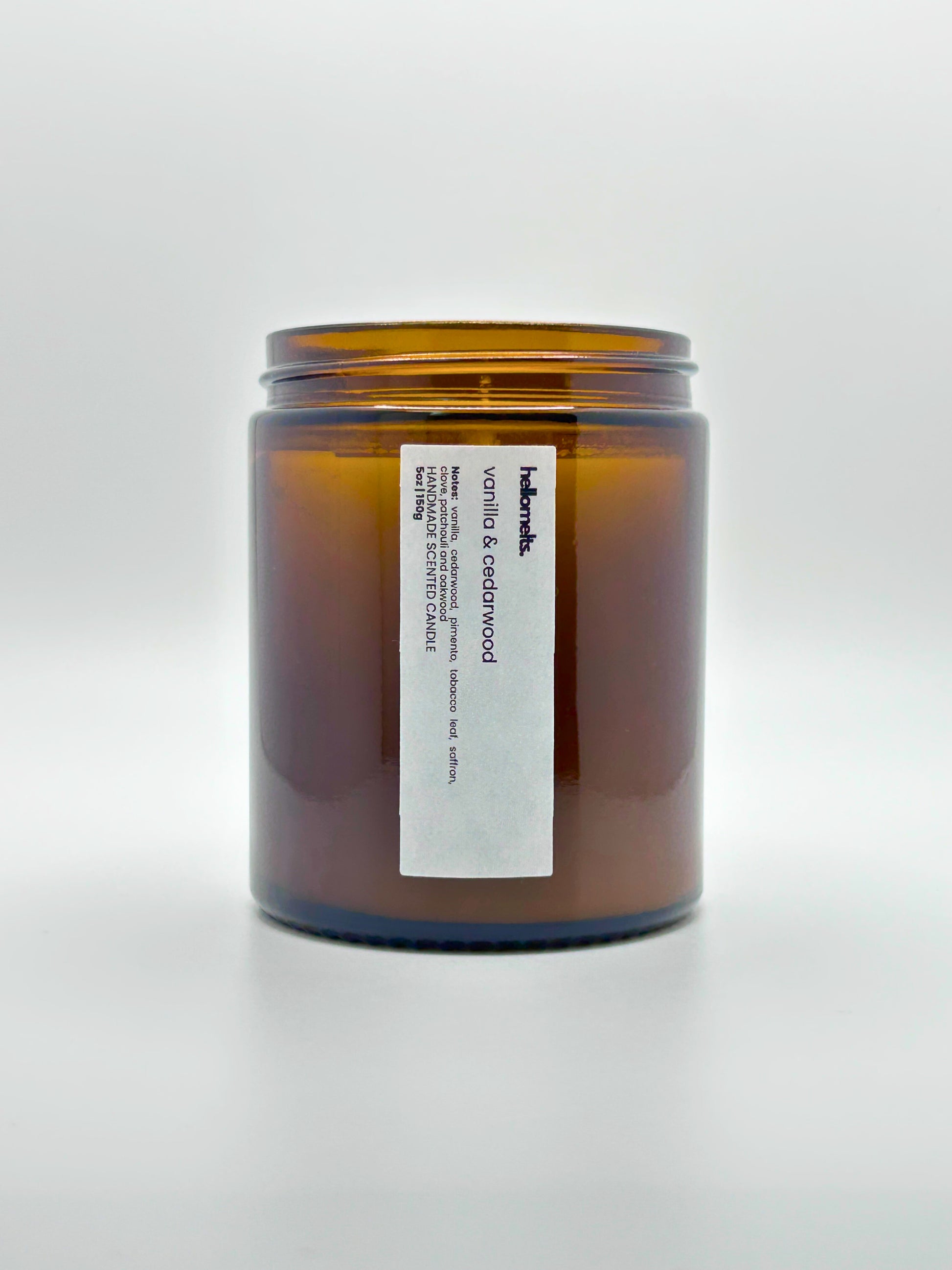 Front view of Vanilla & Cedarwood autumn scented candle by Hellomelts with the lid off, part of the Autumn Collection