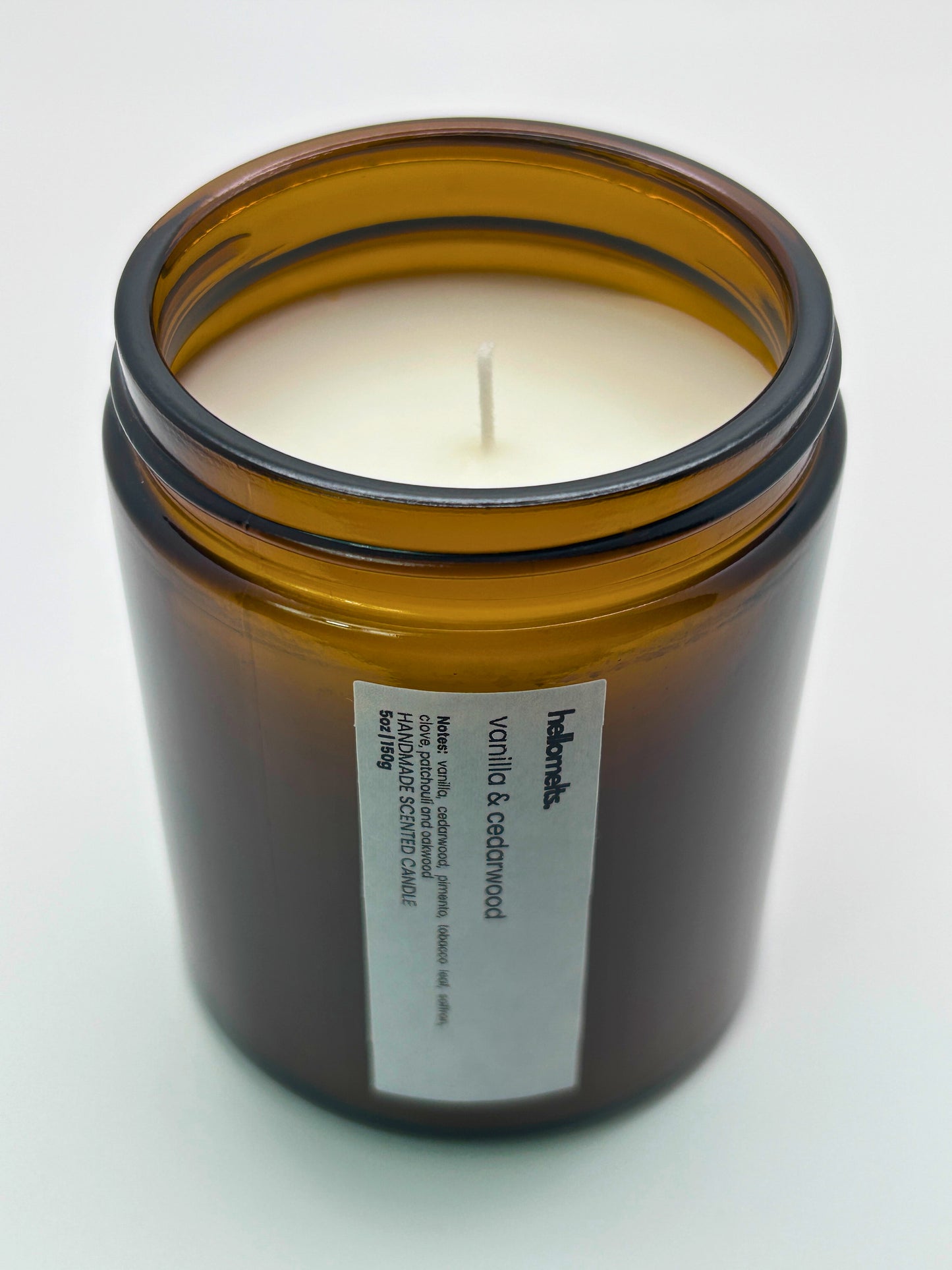 Angled top-down view of Vanilla & Cedarwood autumn candle by Hellomelts, highlighting the wick and hand-poured wax, part of the Autumn Collection