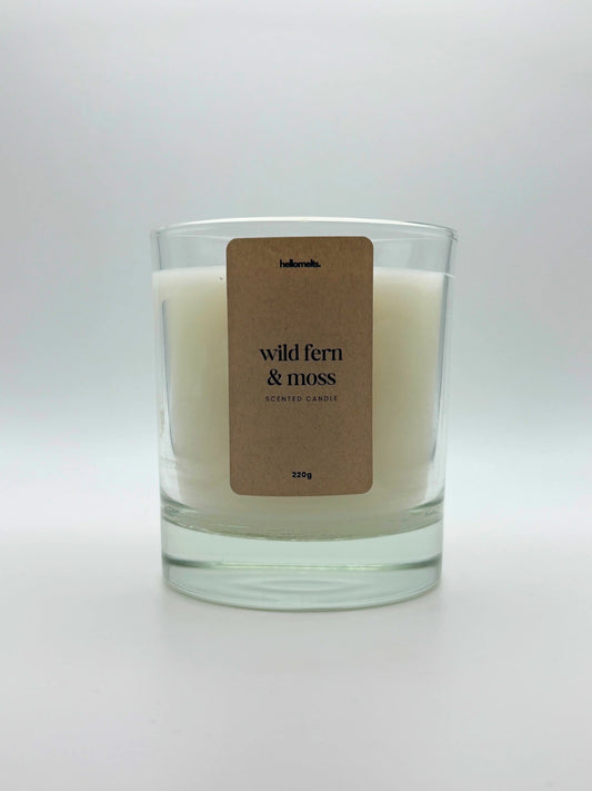Front view of Wild Fern & Moss scented candle by Hellomelts, featuring a clean white wax in a clear glass jar, part of the Spring Collection.