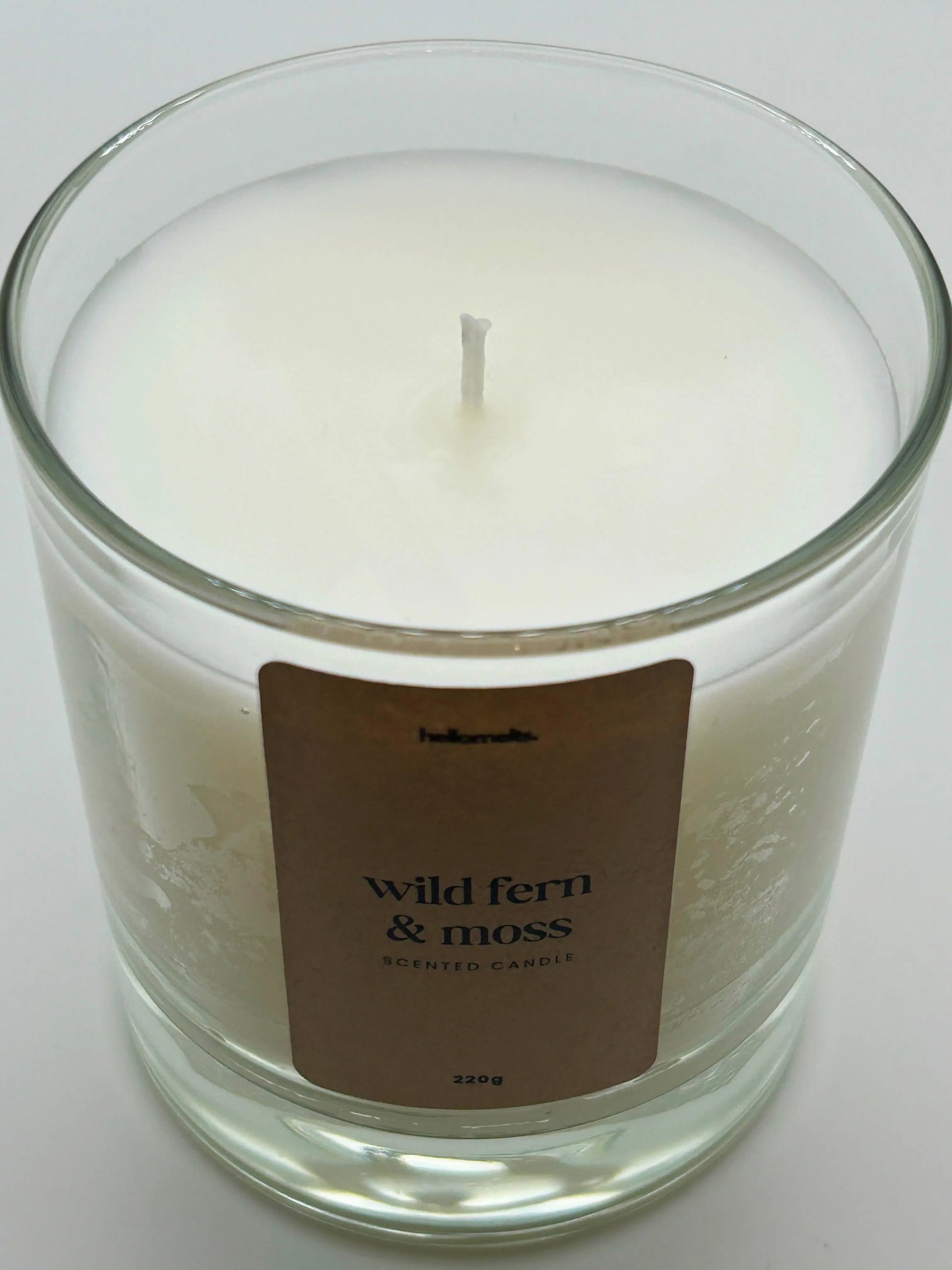 Close-up detail of the Wild Fern & Moss candle wax and wick, highlighting the clean white wax used in Hellomelts' Spring Collection.