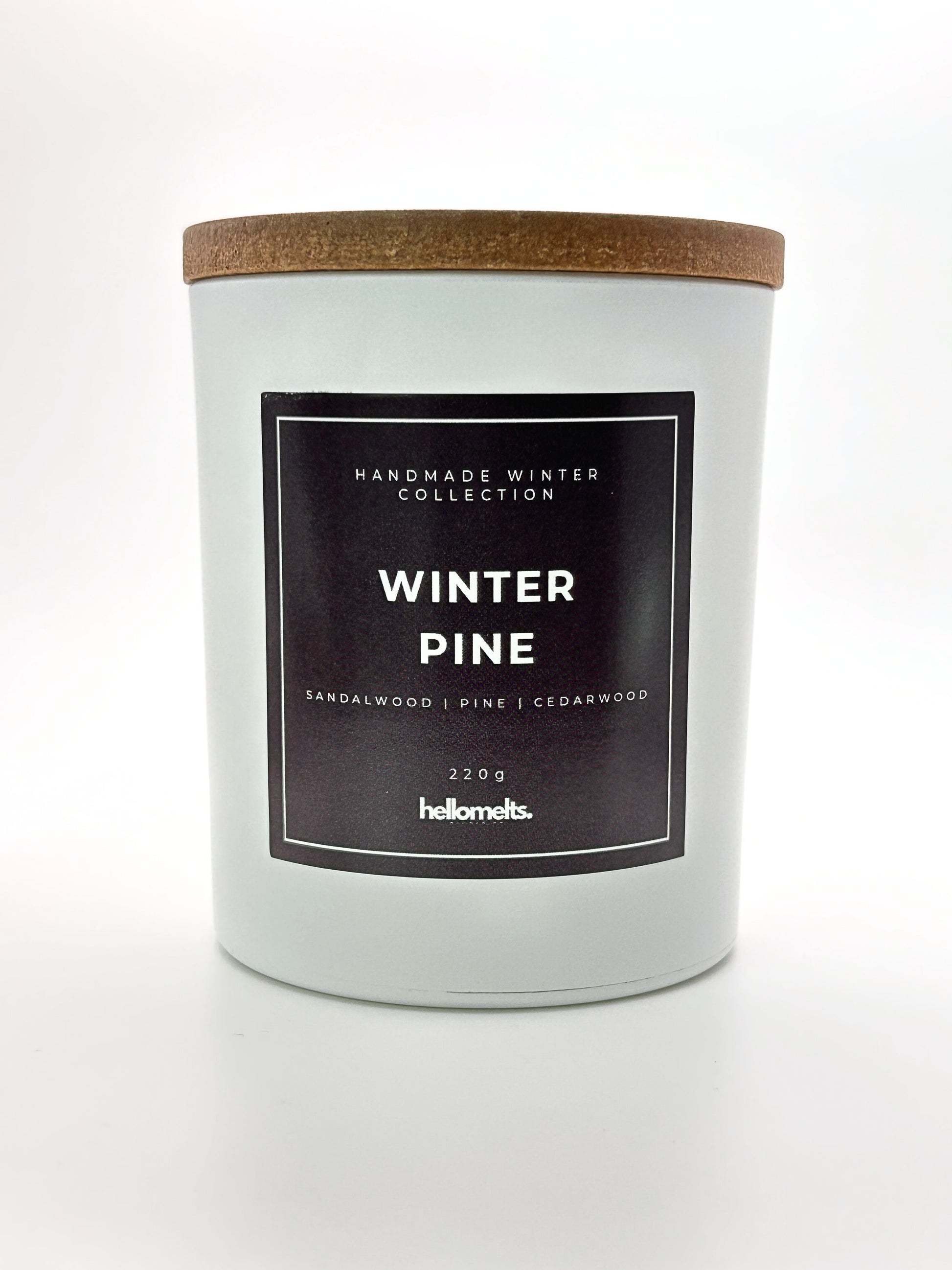 Winter Pine 220g candle front-facing studio shot with wooden lid on, part of the Hellomelts Winter Collection