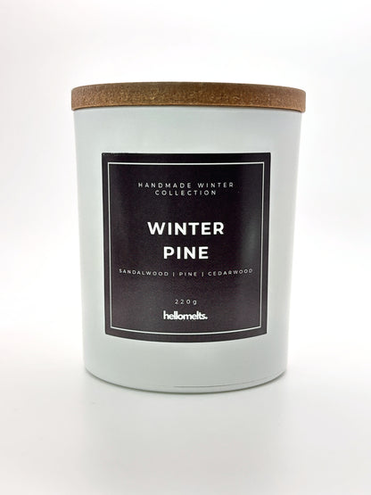 Winter Pine 220g candle front-facing studio shot with wooden lid on, part of the Hellomelts Winter Collection
