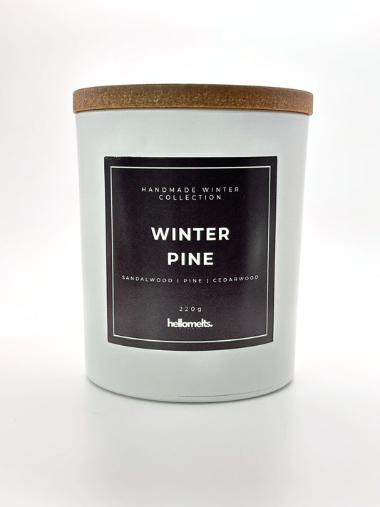Winter Pine 220g candle front-facing studio shot with wooden lid on, part of the Hellomelts Winter Collection
