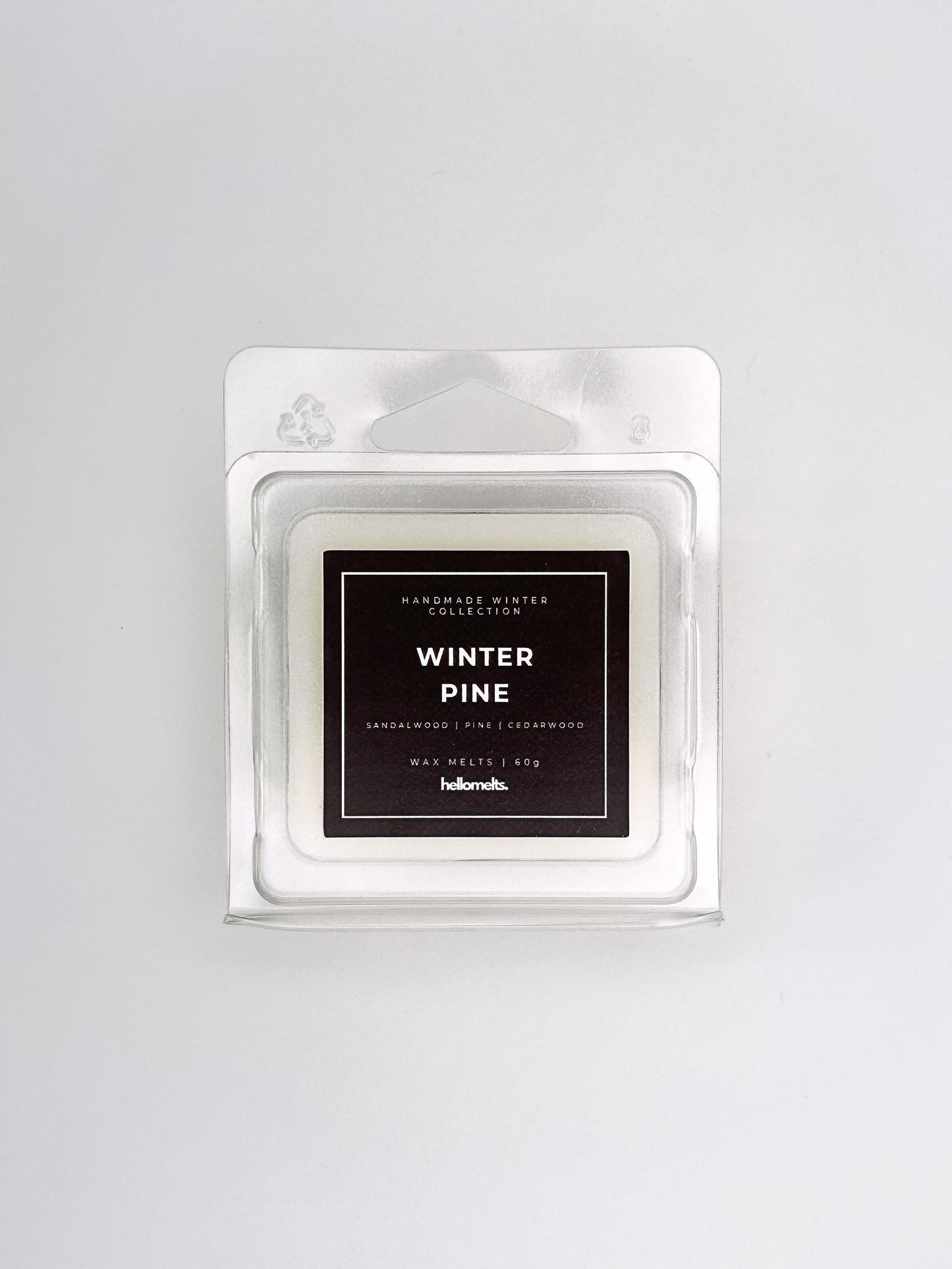 Winter Pine 60g wax melt front-facing studio shot showing the clamshell packaging from the Hellomelts Winter Collection